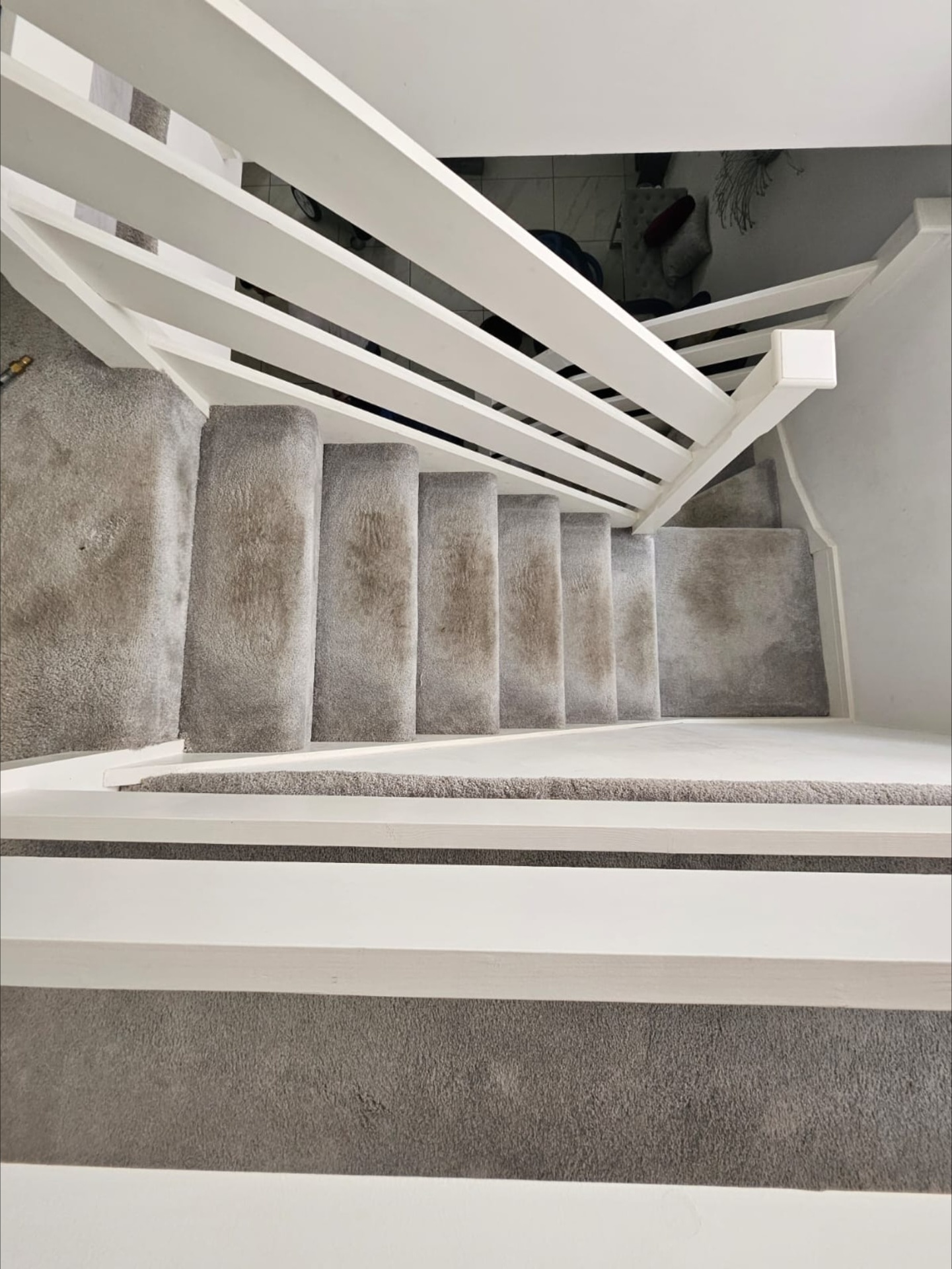 Stained stair carpet before cleaning